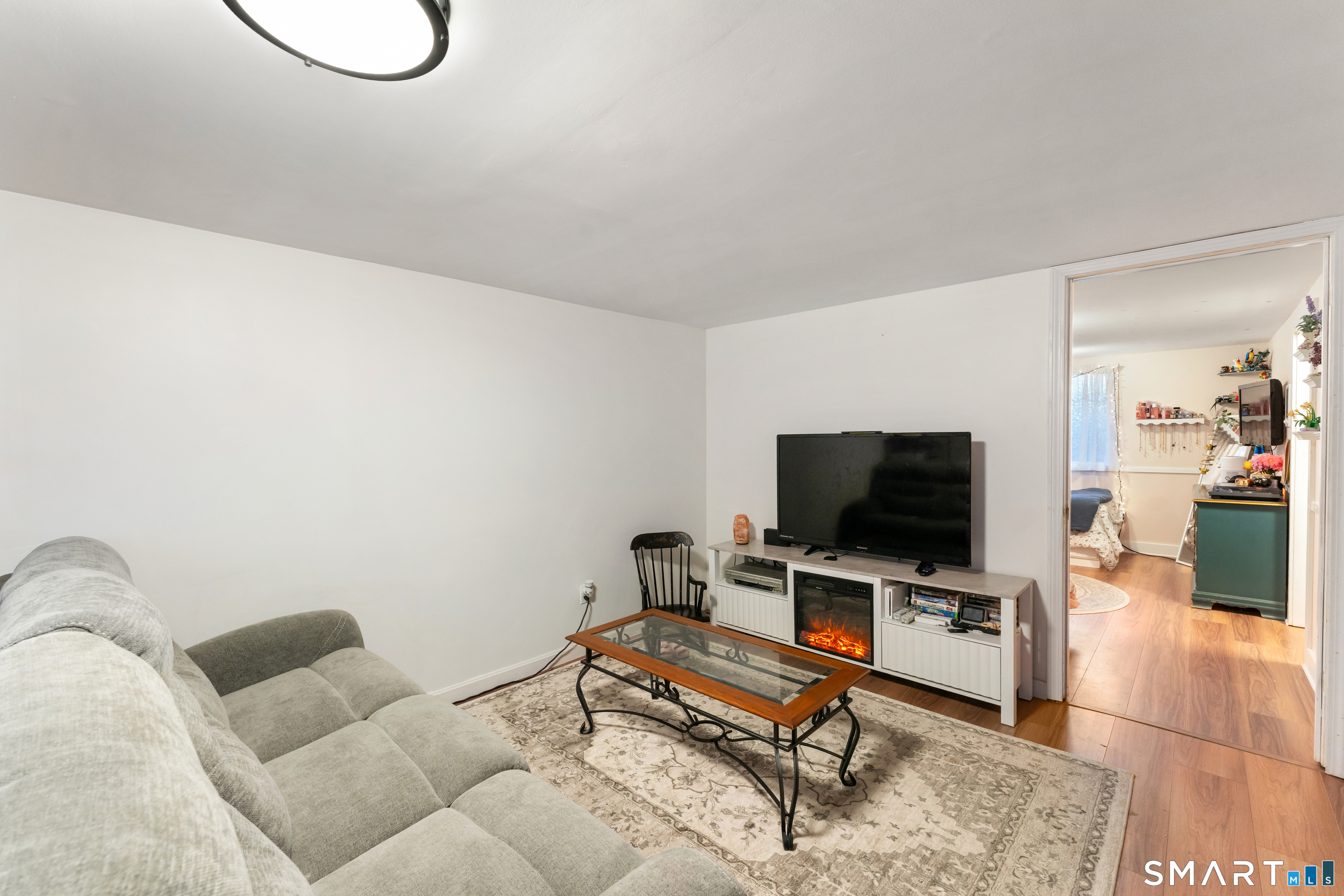 14 Liberty Lane Thompson, CT 06277 - Photo 35 of 39 a living room with furniture and a flat screen tv