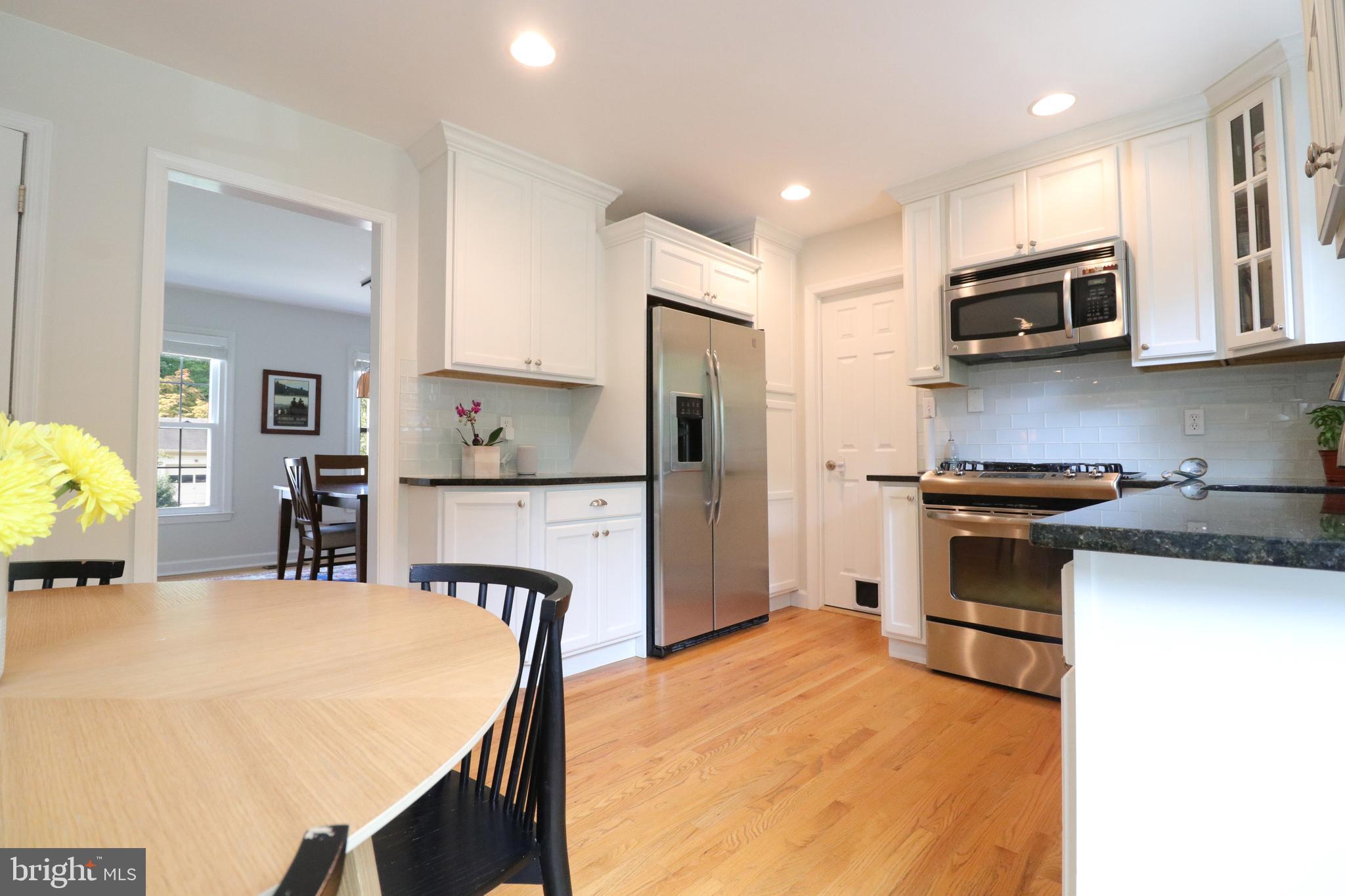 9320 Winbourne Road Burke, VA 22015 - Photo 11 of 55 New white cabinets with SS appliances.