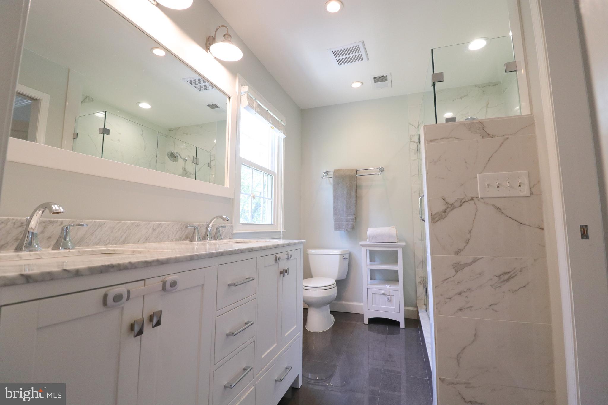9320 Winbourne Road Burke, VA 22015 - Photo 28 of 55 Primary bath - updated cabinets, tile and lighting
