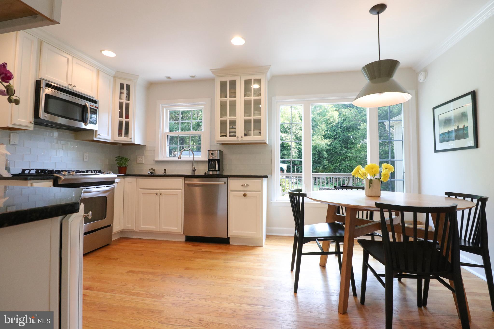 9320 Winbourne Road Burke, VA 22015 - Photo 9 of 55 Glass tile backsplash and updated lighting.