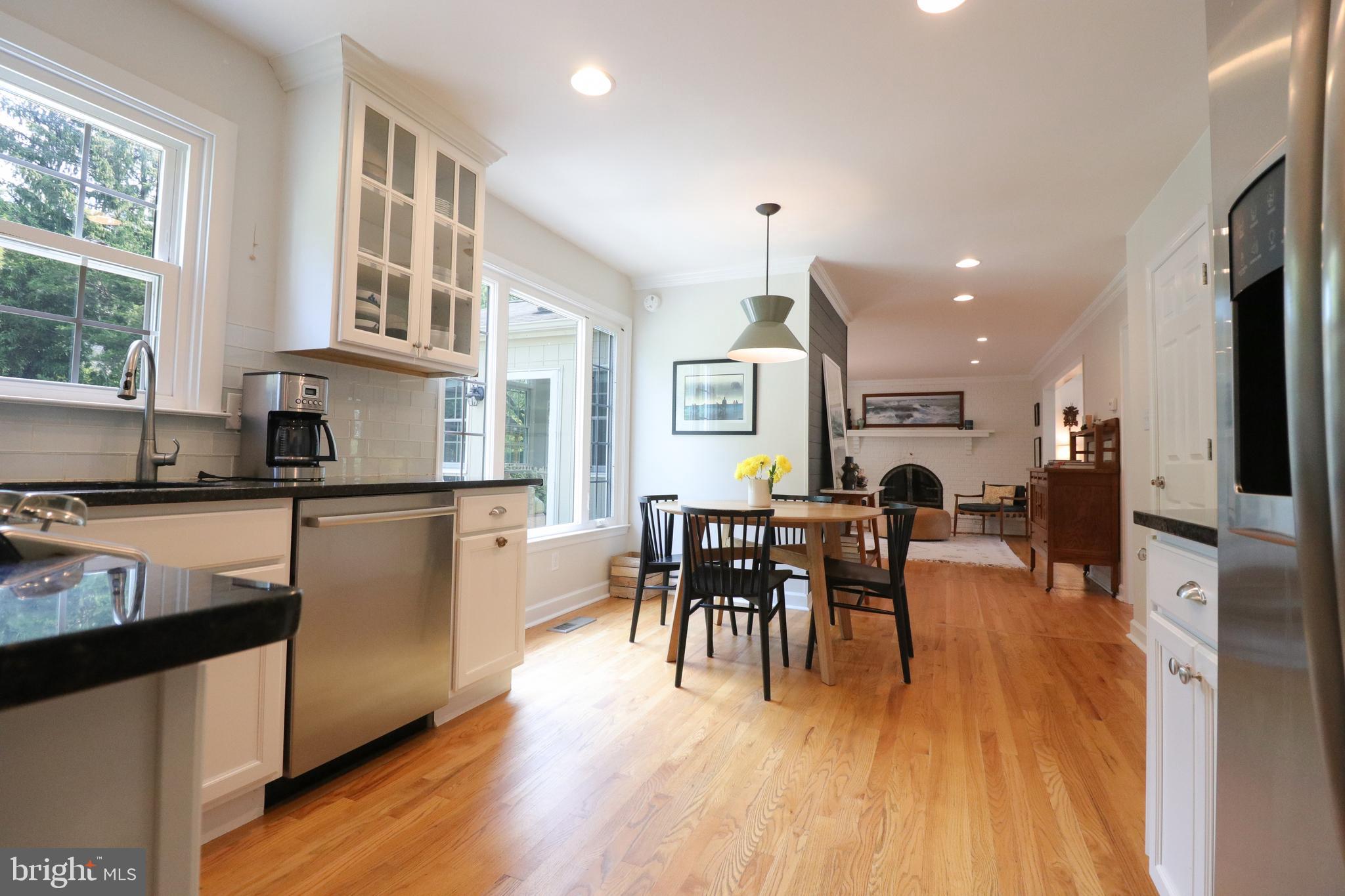 9320 Winbourne Road Burke, VA 22015 - Photo 10 of 55 Granite countertops and glass front cabinets.