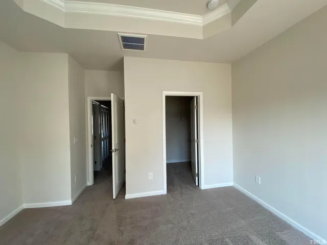 a view of an empty room and closet