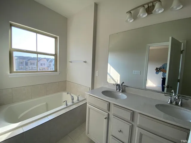 a bathroom with a bathtub and a sink