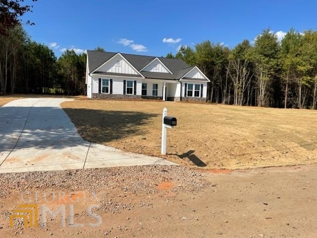 866 John Deere Road Northwest Monroe, GA 30656 - Photo 1 of 1 a front view of a house with a yard