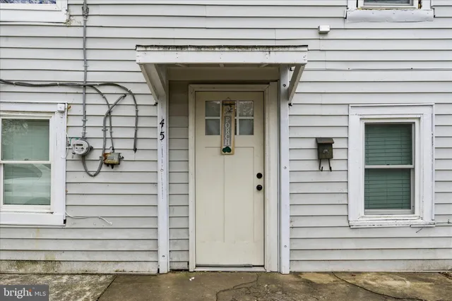 a view of front door and a window