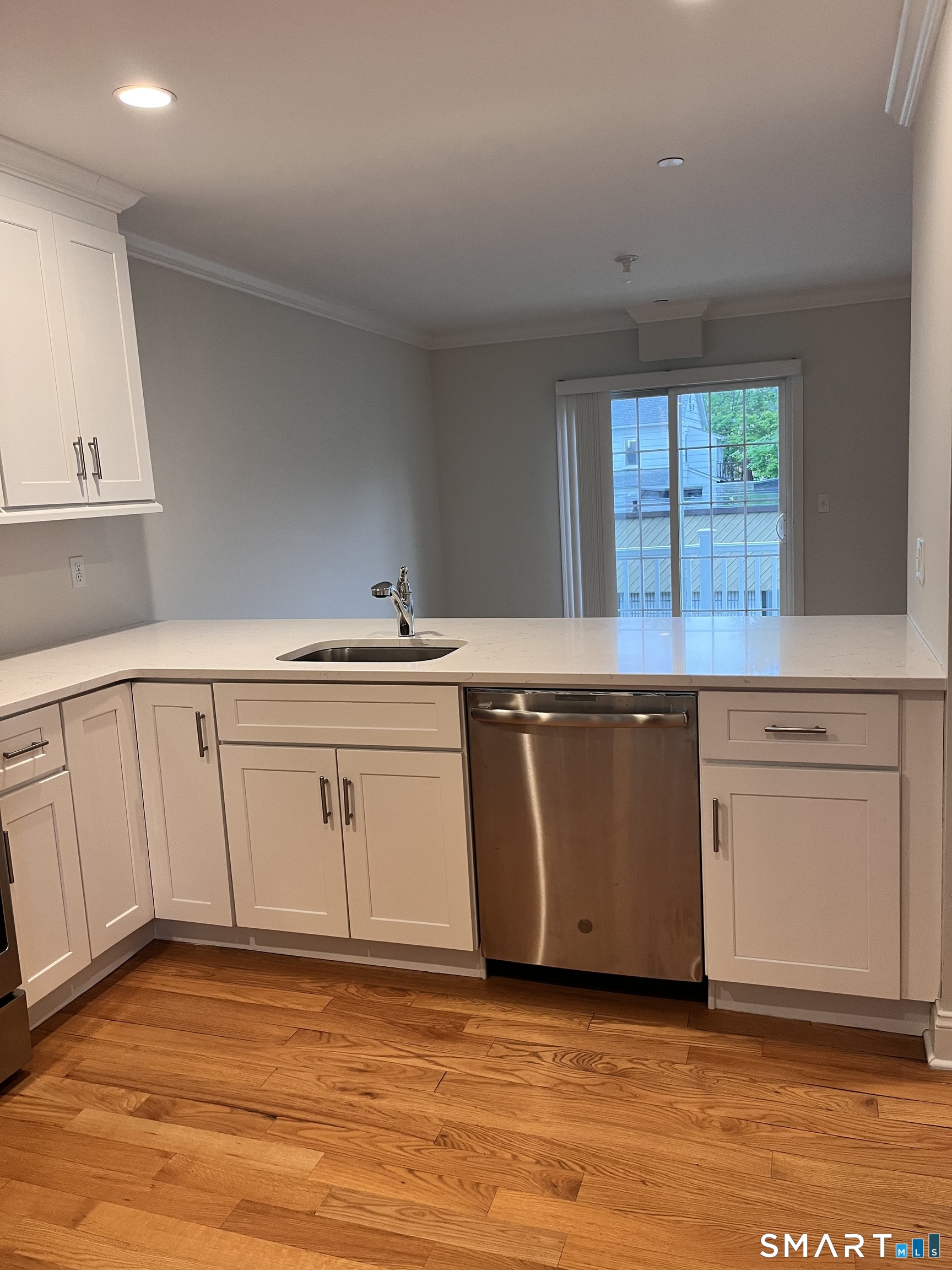 20 3rd Street, Unit 18 Stamford, CT 06905 - Photo 11 of 28 a view of a kitchen with wooden floor