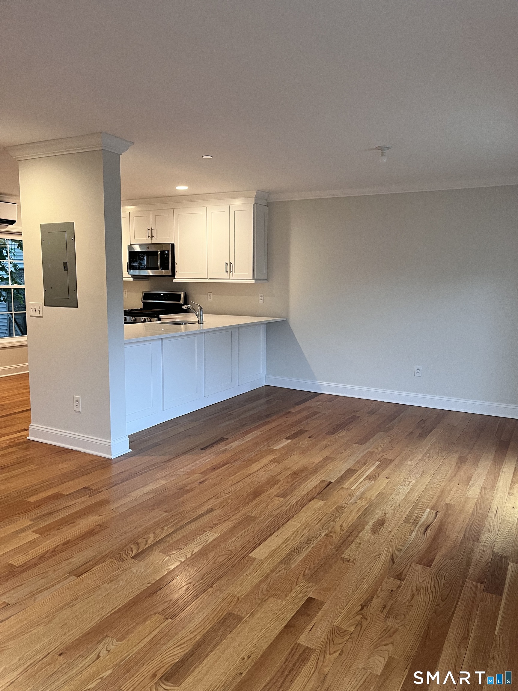 20 3rd Street, Unit 18 Stamford, CT 06905 - Photo 15 of 28 a view of kitchen and wooden floor
