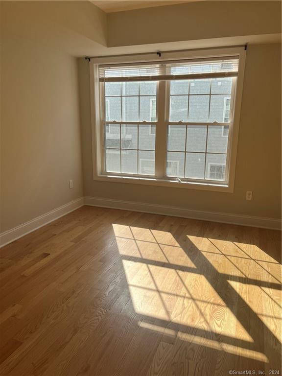 20 3rd Street, Unit 18 Stamford, CT 06905 - Photo 2 of 28 a view of empty room with windows