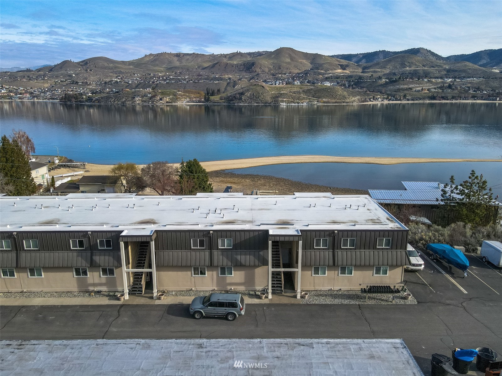 an aerial view of a house with a lake view