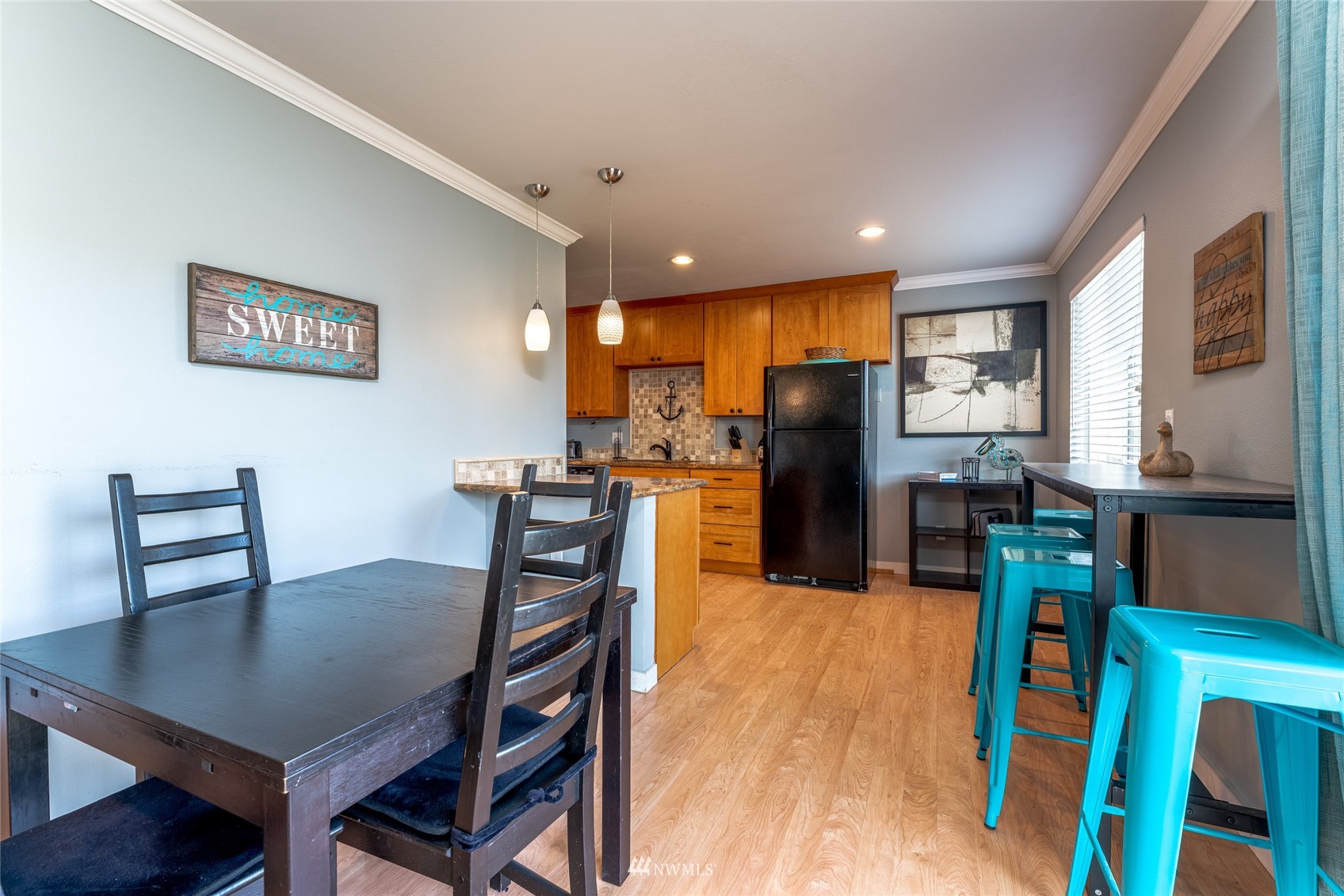 1902 West Prospect Street, Unit 112 Chelan, WA 98816 - Photo 13 of 40 a view of a dining room with furniture and wooden floor