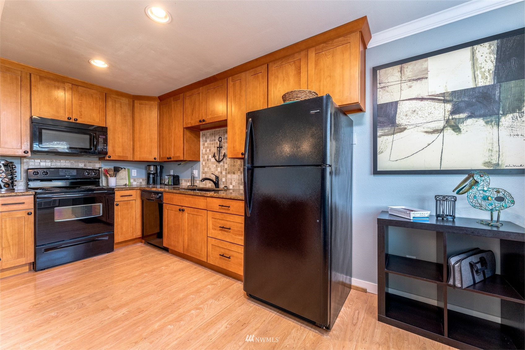 1902 West Prospect Street, Unit 112 Chelan, WA 98816 - Photo 14 of 40 a kitchen with granite countertop a refrigerator stove and oven