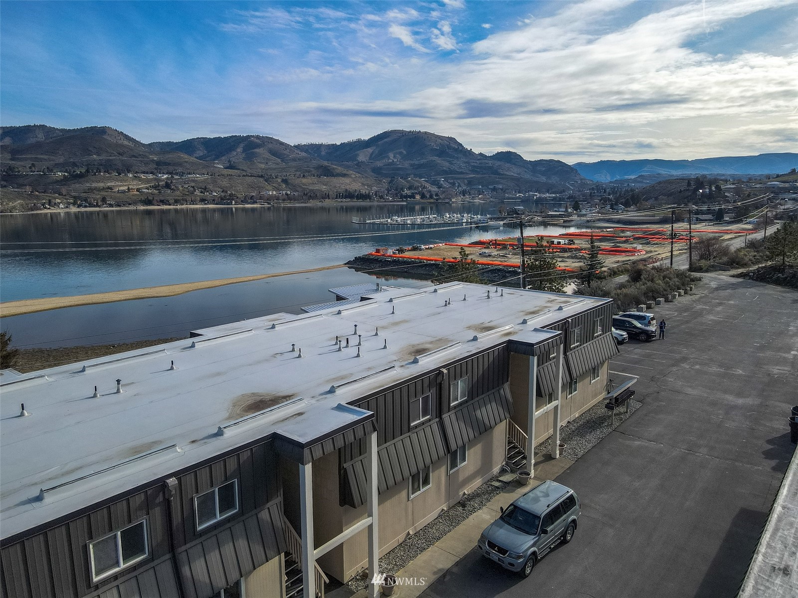 1902 West Prospect Street, Unit 112 Chelan, WA 98816 - Photo 6 of 40 a view of a lake with a mountain