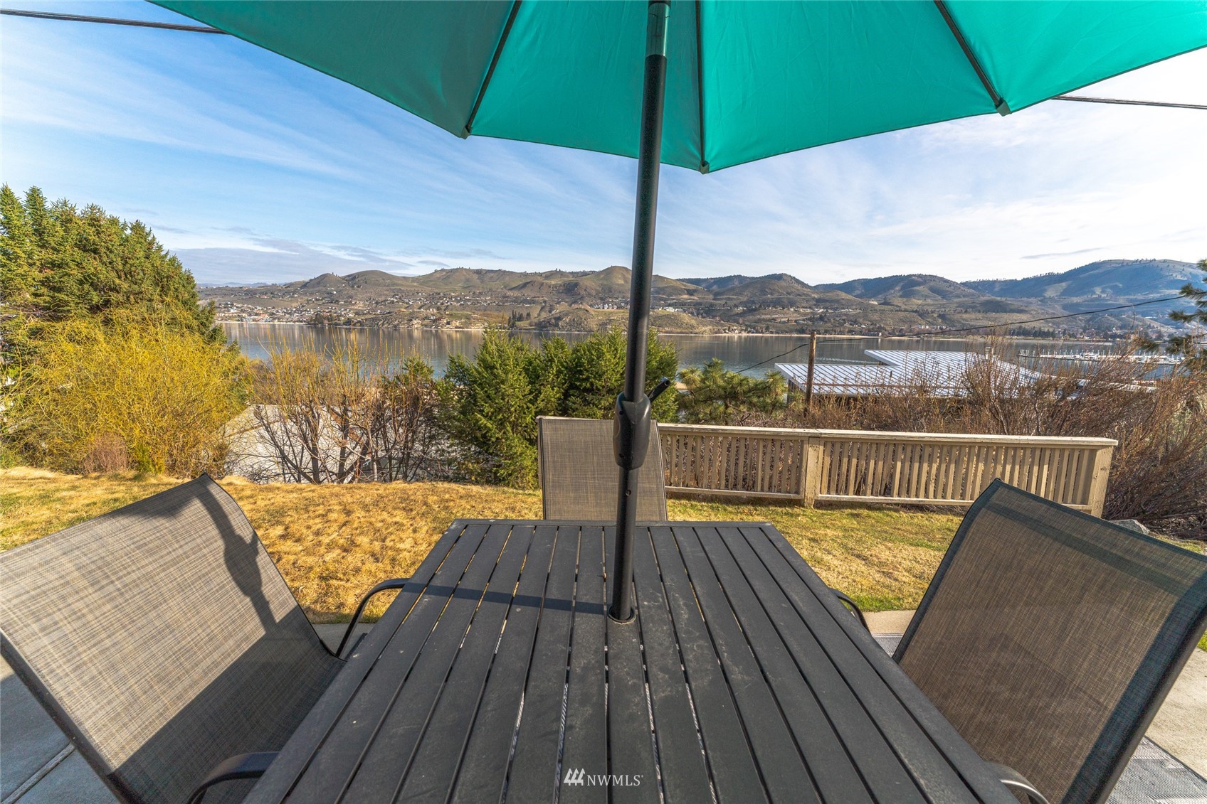 1902 West Prospect Street, Unit 112 Chelan, WA 98816 - Photo 10 of 40 a view of a balcony with wooden floor and lake view