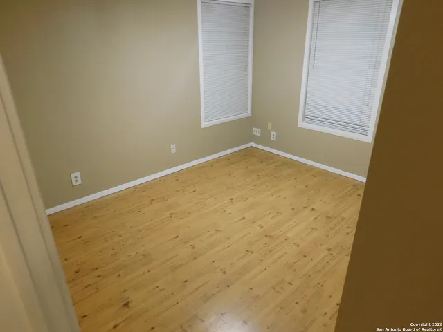 a view of empty room with a door