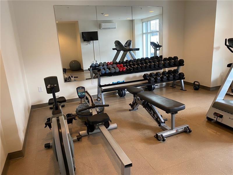 1655 Fifth Avenue, Unit 409 Pittsburgh, PA 15219 - Photo 9 of 16 a room with gym equipment and windows