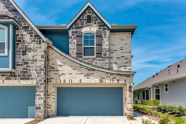 a view of a house with brick walls and windows