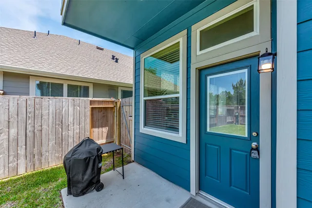 a view of a house with a door and a chair