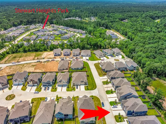 a view of multiple houses with yard