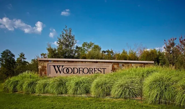 a view of swimming pool with a yard and plants