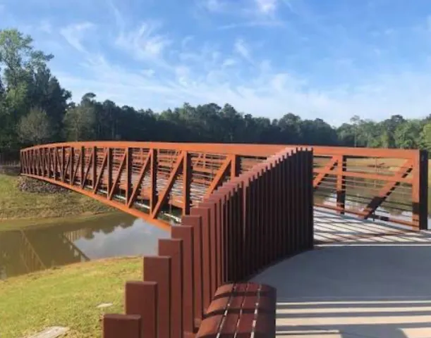 a view of swimming pool with lake and mountain view in back