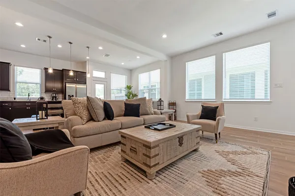 a living room with furniture and a table