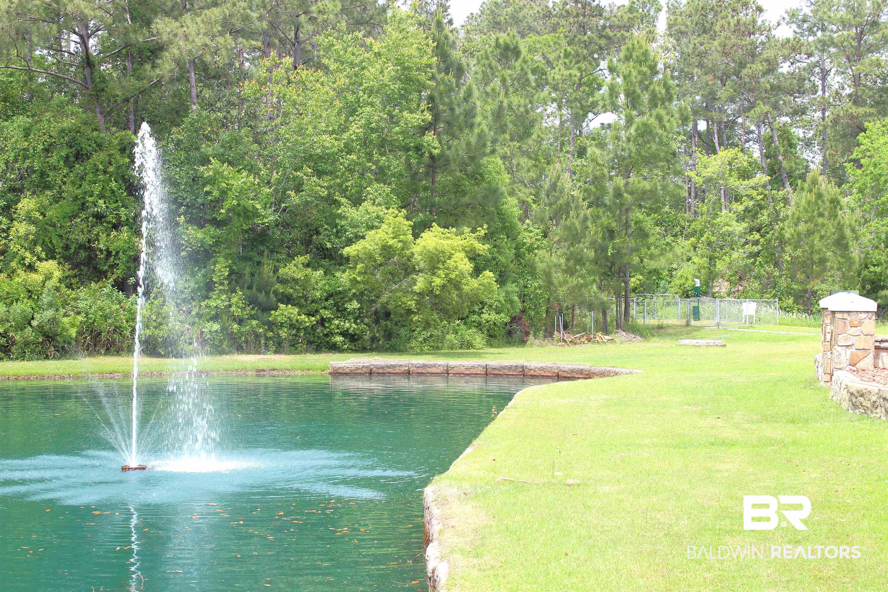 11869 Gateway Drive Elberta, AL 36530 - Photo 49 of 78 Property view of water featuring a wooded view and fence