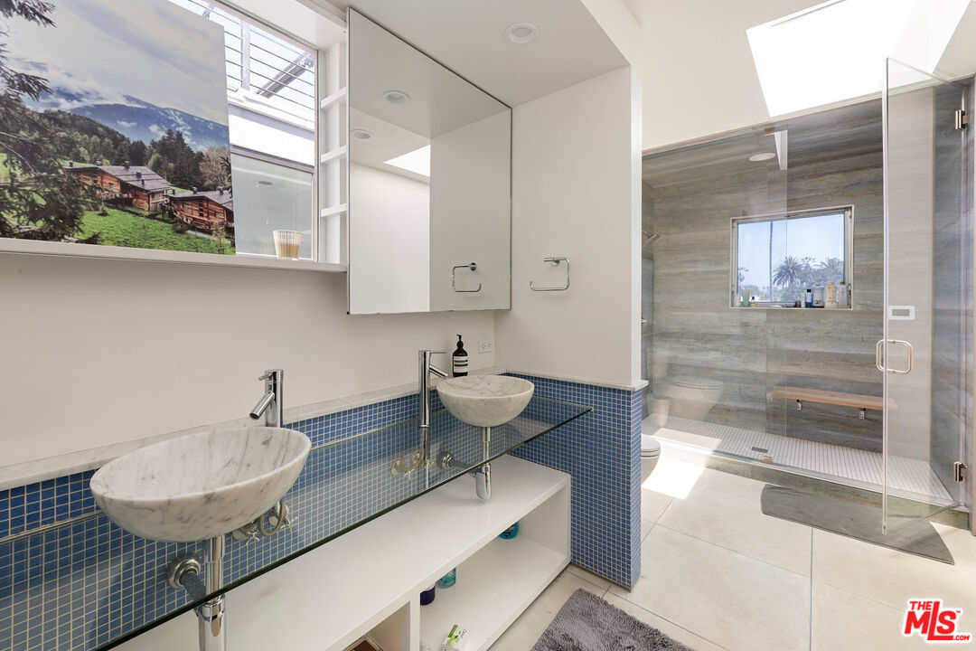 417 Venice Way Venice, CA 90291 - Photo 20 of 53 a bathroom with a sink and a mirror