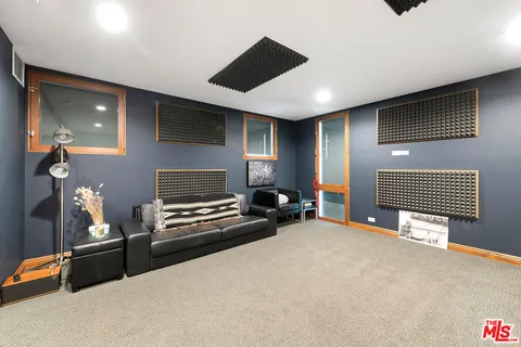 a view of room with a flat screen tv