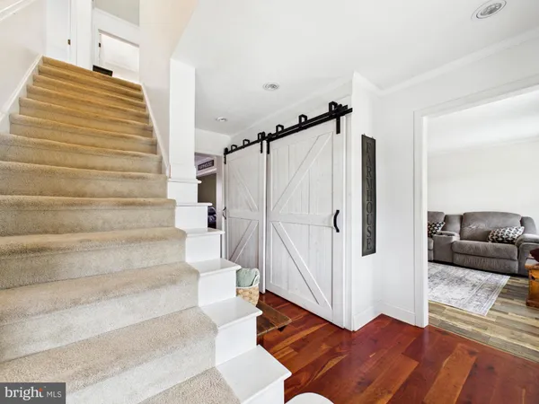 a view of walk in closet with clothes