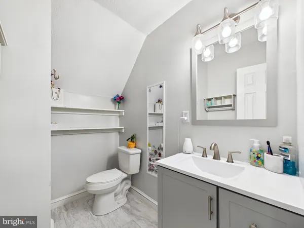 a view of a lake with houses in the back