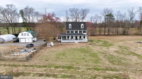 a kitchen with stainless steel appliances granite countertop a sink a stove and refrigerator