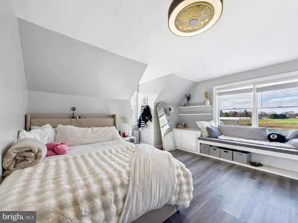 a living room with fireplace furniture and a flat screen tv