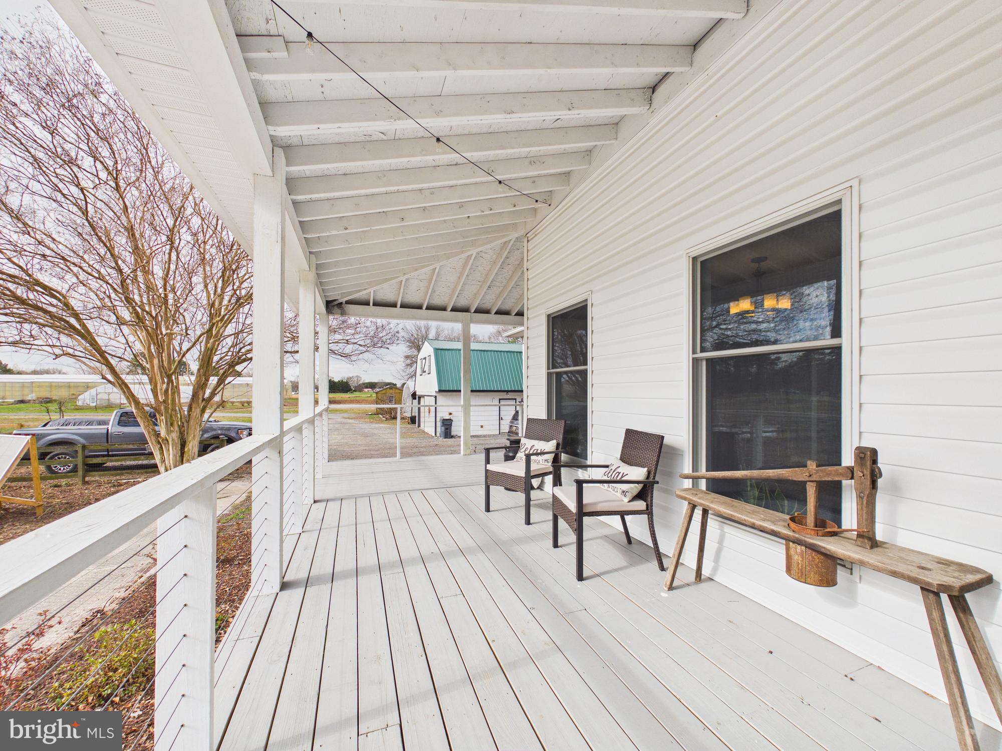 8416 Harmony Road Denton, MD 21629 - Photo 44 of 111 Wrap around front porch with cable railing