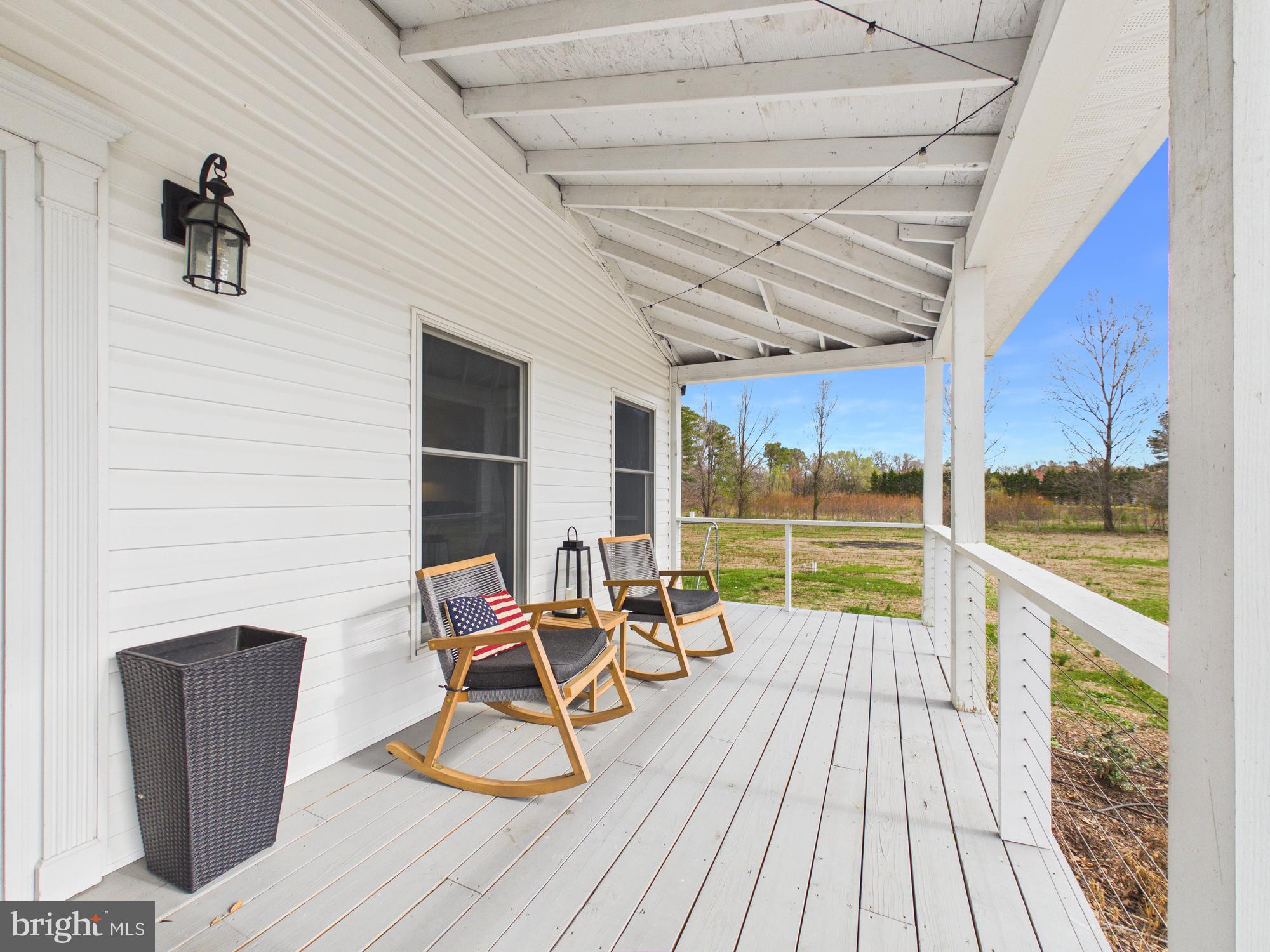 8416 Harmony Road Denton, MD 21629 - Photo 45 of 111 Wrap around front porch with cable railing