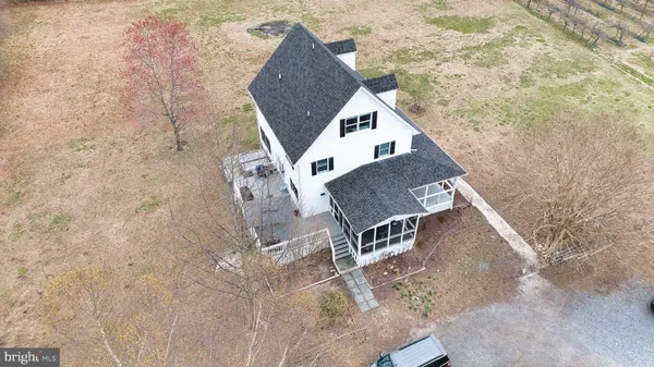 a bedroom with furniture and a mirror