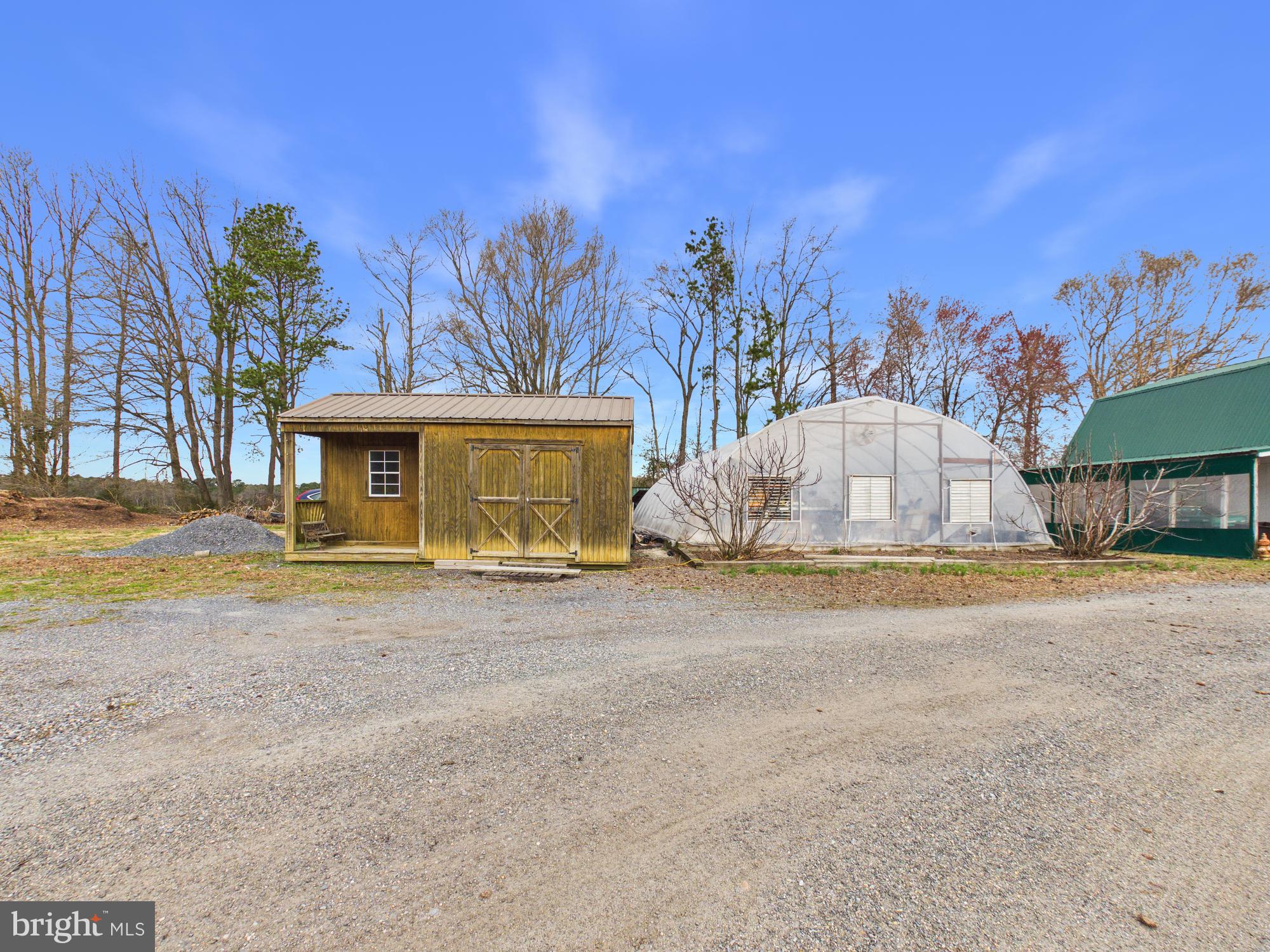 8416 Harmony Road Denton, MD 21629 - Photo 87 of 111 Equipment shed, smaller green house and garage