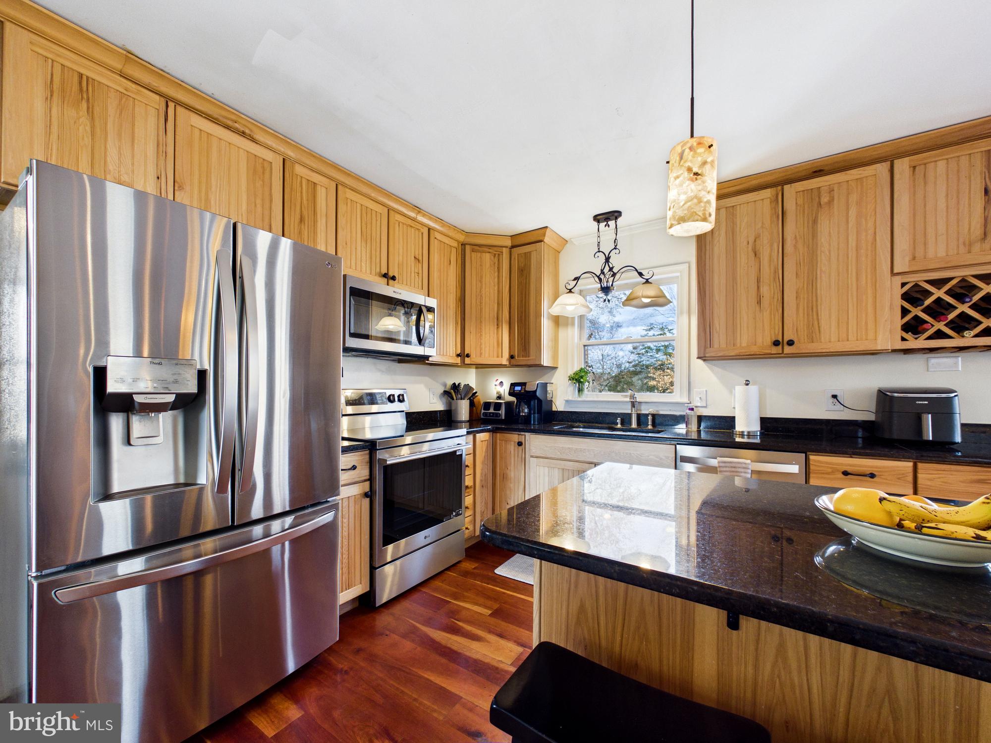 8416 Harmony Road Denton, MD 21629 - Photo 9 of 111 Open concept kitchen with granite countertops