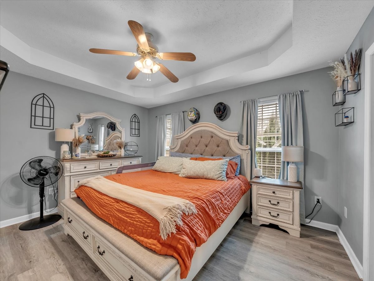 9 Merideth Lynn Road Fayetteville, TN 37334 - Photo 16 of 31 a bedroom with a bed and wooden floor