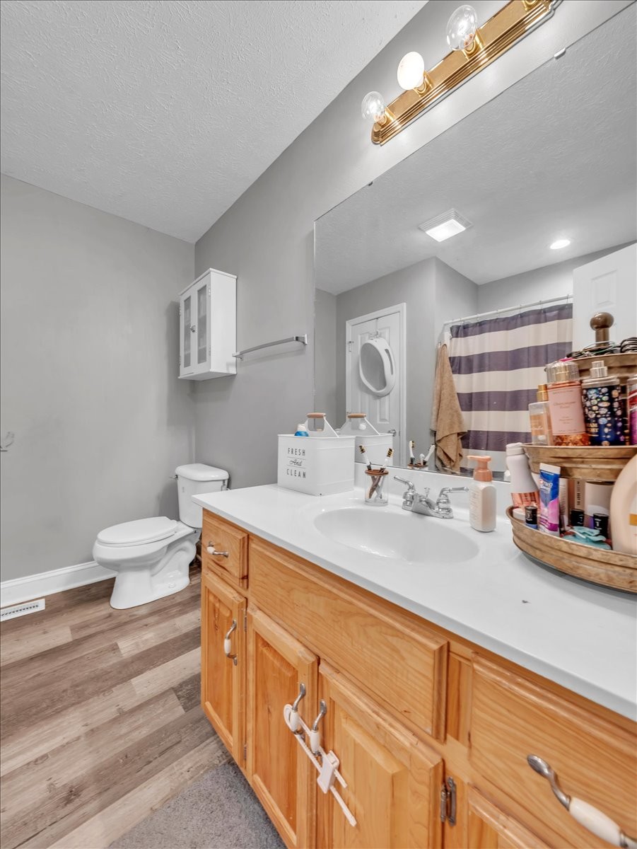 9 Merideth Lynn Road Fayetteville, TN 37334 - Photo 19 of 31 a bathroom with a double vanity sink toilet and a tub
