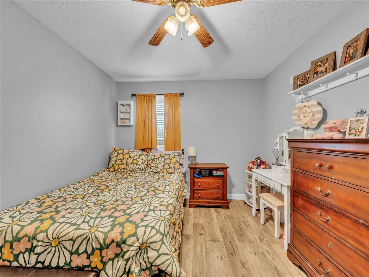 9 Merideth Lynn Road Fayetteville, TN 37334 - Photo 21 of 31 a bedroom with a bed and wooden floor