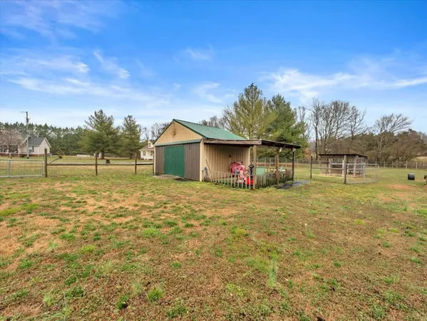 a view of a big yard with a house