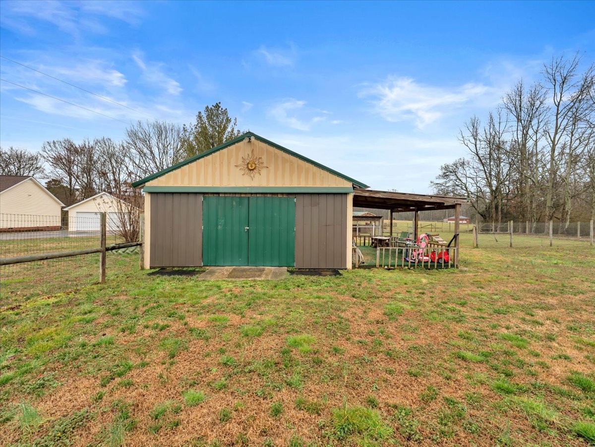 9 Merideth Lynn Road Fayetteville, TN 37334 - Photo 26 of 31 a view of a house with a yard and garage