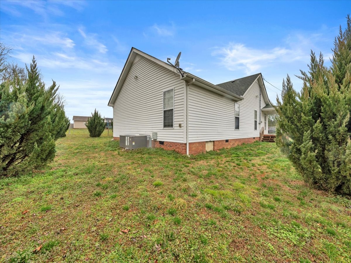 9 Merideth Lynn Road Fayetteville, TN 37334 - Photo 4 of 31 a view of a backyard with plants and large tree