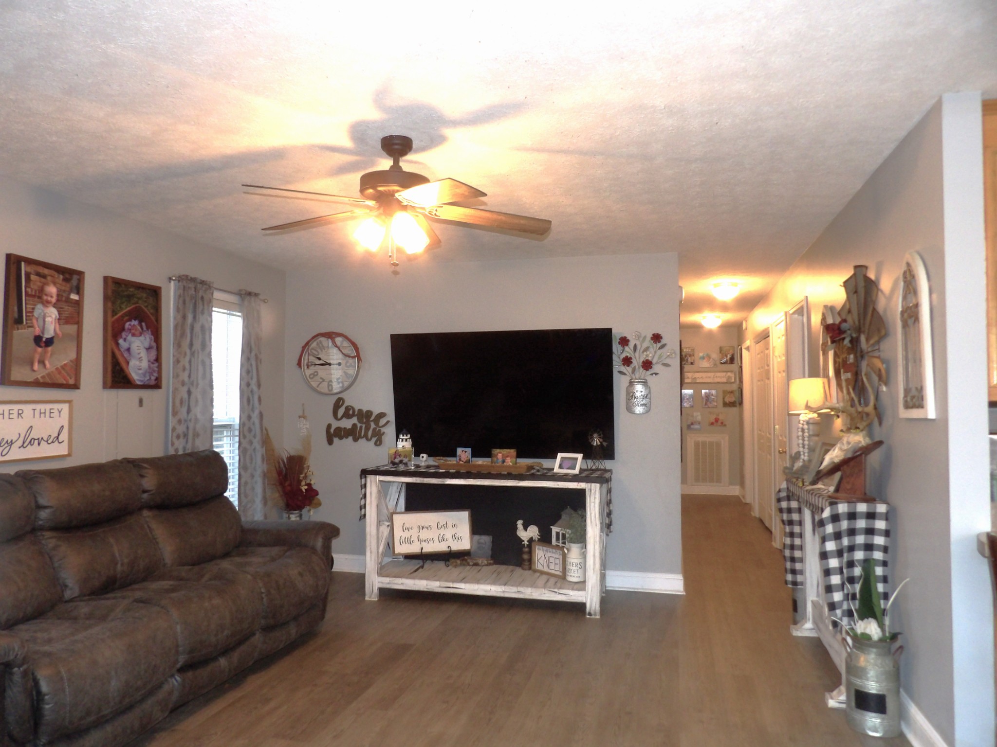 9 Merideth Lynn Road Fayetteville, TN 37334 - Photo 10 of 31 a living room with furniture a flat screen tv and a fireplace