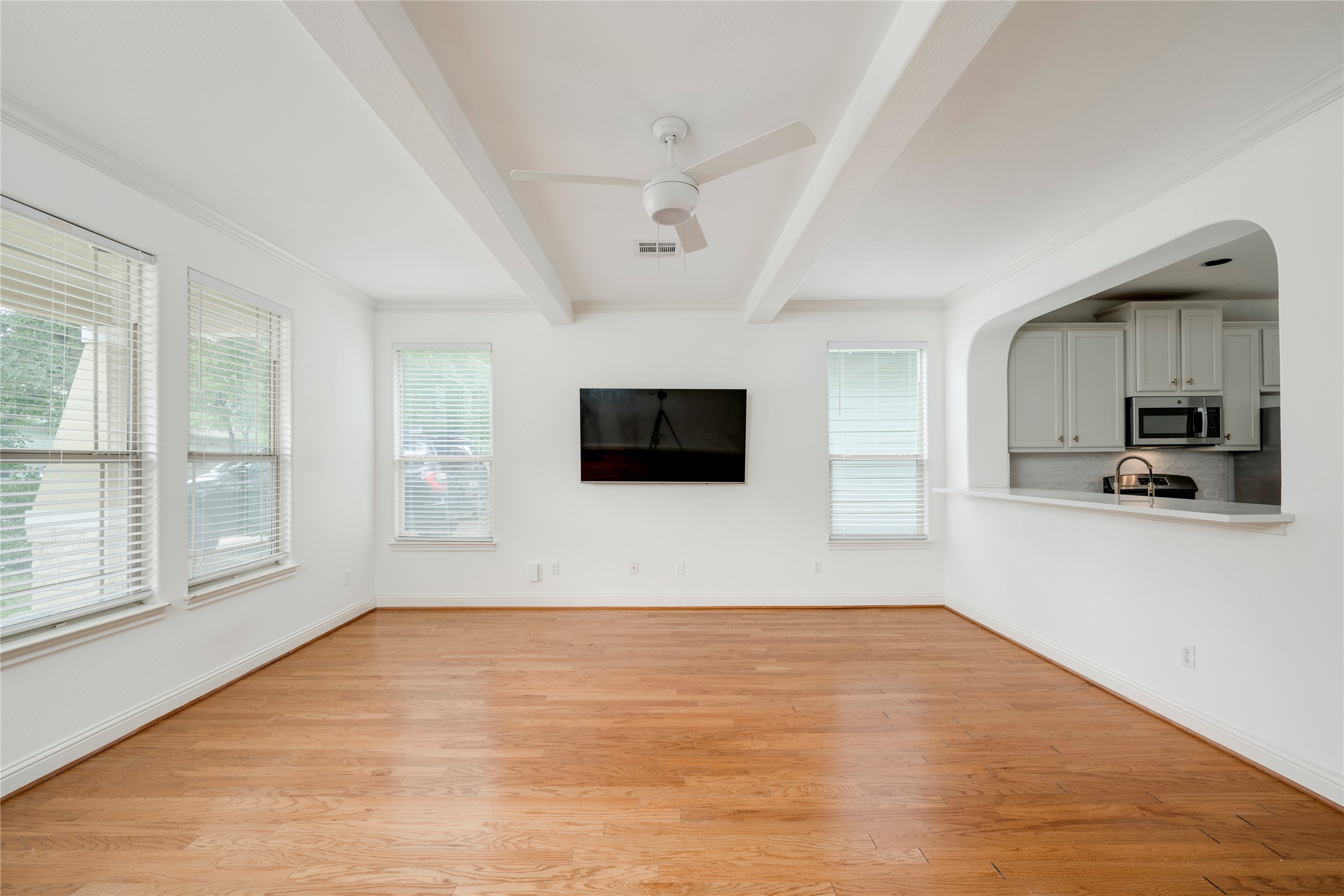 6008 Whipple Way Austin, TX 78745 - Photo 6 of 39 Bright hardwood floors and high ceilings define this inviting living area, open to the kitchen.