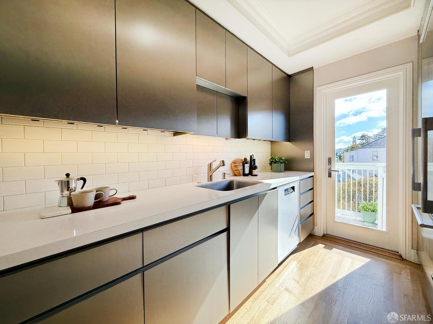 639 14th Street San Francisco, CA 94114 - Photo 14 of 54 a kitchen with cabinets and window