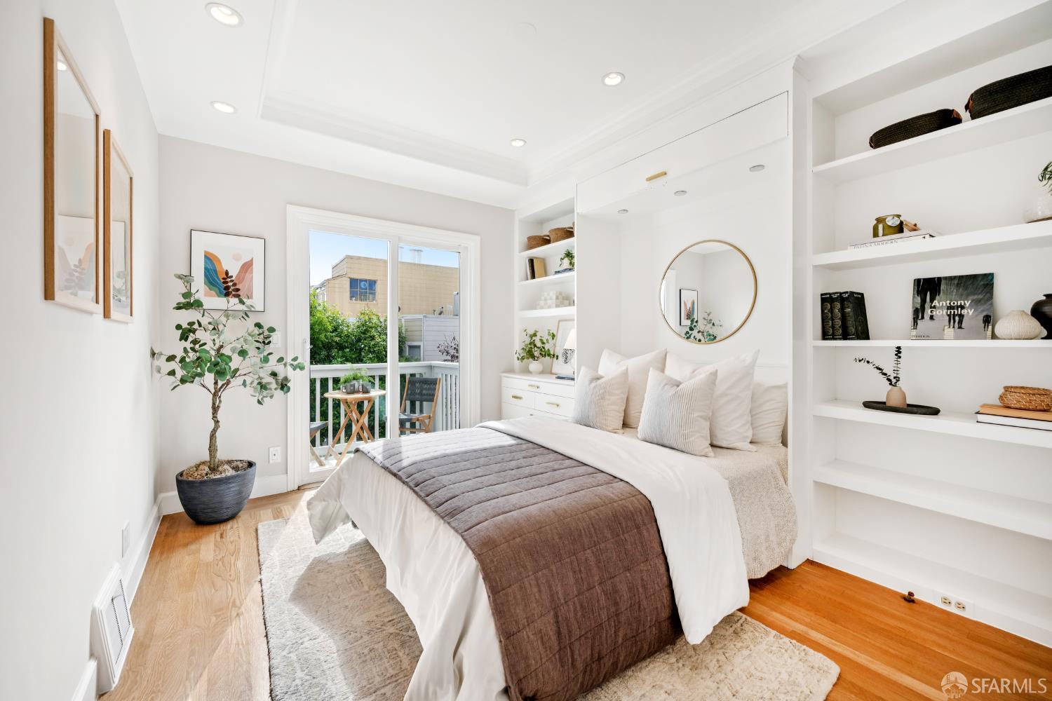 639 14th Street San Francisco, CA 94114 - Photo 21 of 54 a bedroom with a large bed and a potted plant