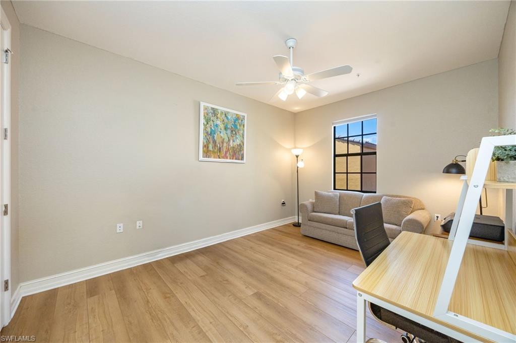 9128 Delano Street, Unit 892 Naples, FL 34113 - Photo 21 of 49 a view of a livingroom with furniture and wooden floor