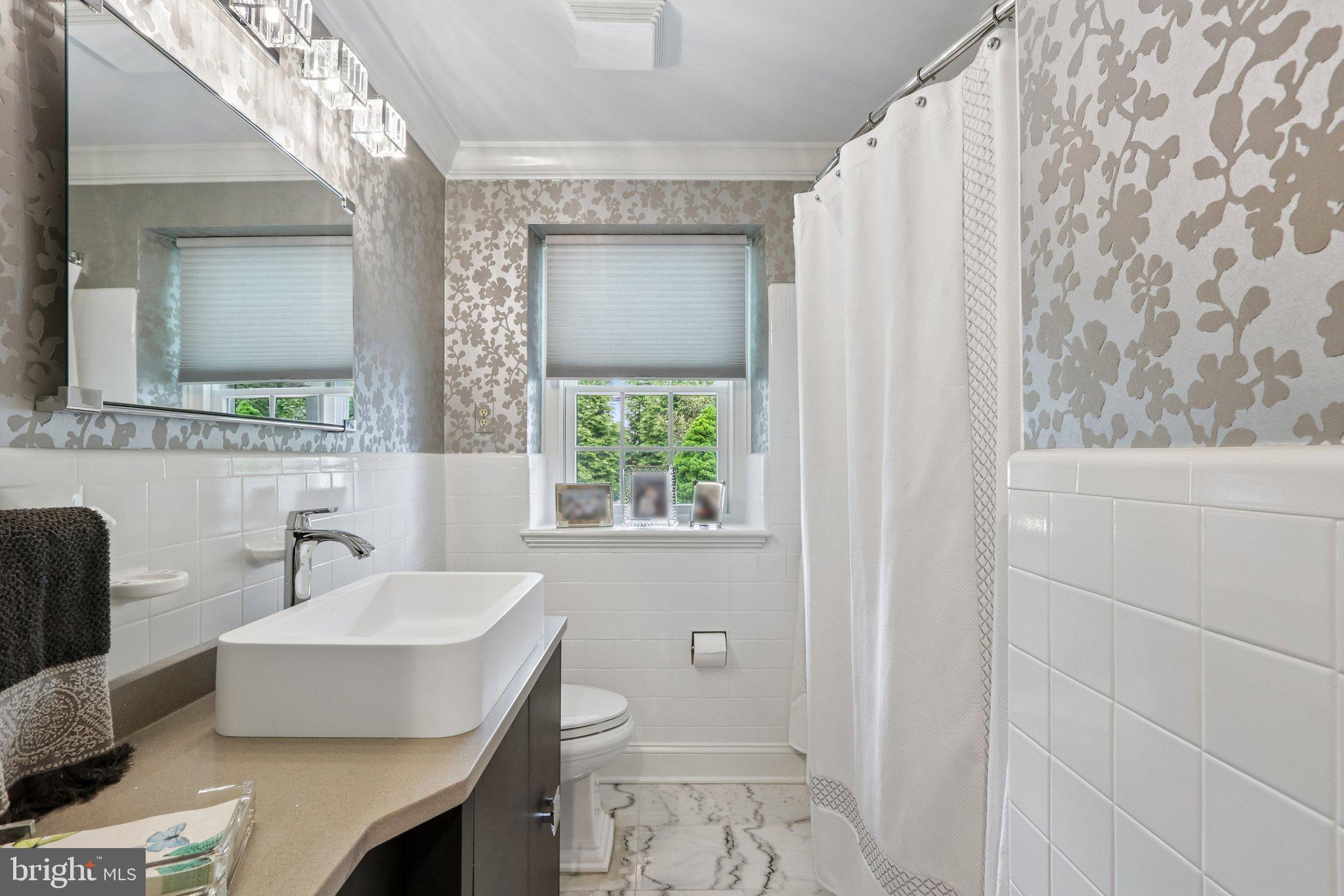 209 Welsh Road Ambler, PA 19002 - Photo 16 of 80 a bathroom with a sink toilet and mirror