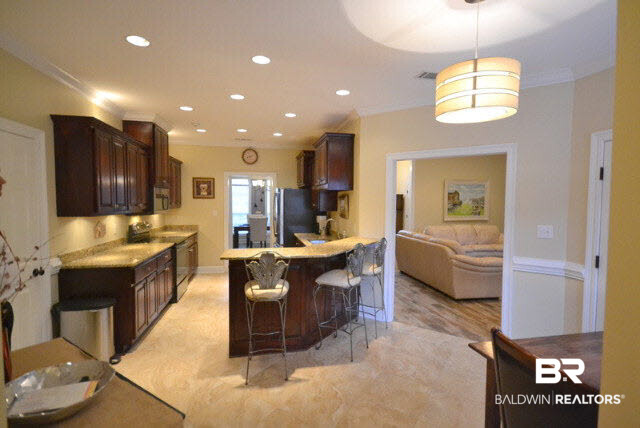 1640 Augusta Drive West Mobile, AL 36695 - Photo 6 of 25 Layout is perfect in this kitchen with both an eat-in breakfast nook and breakfast bar.